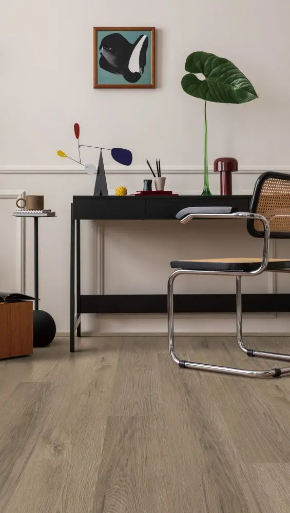 Natural oak wood-look flooring planks in a minimalist home office.